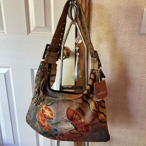 Anuschka, cowhide and hand painted brand new never been used